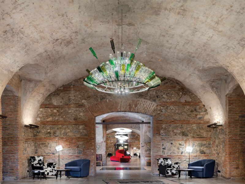 A custom wine bottle chandelier by Ingo Maurer.