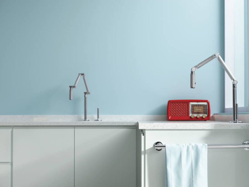Closer shot of faucets with light blue Benjamin Moore paint on wall