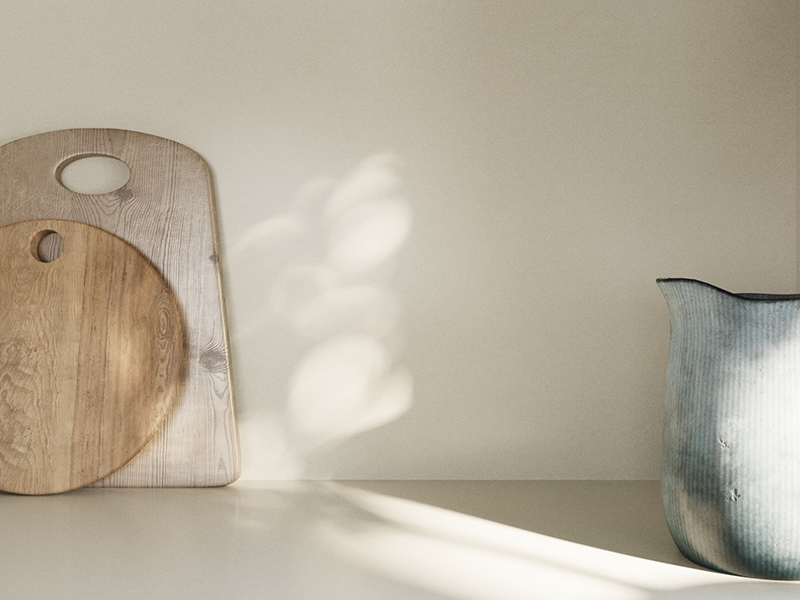 White Silestone countertop with wooden cutting boards resting against the backsplash