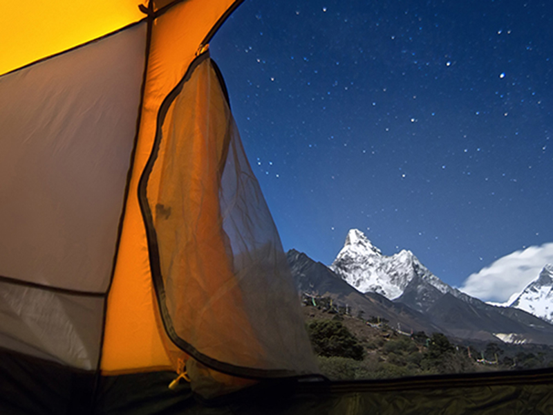 Orange tent open to the view of the mountains