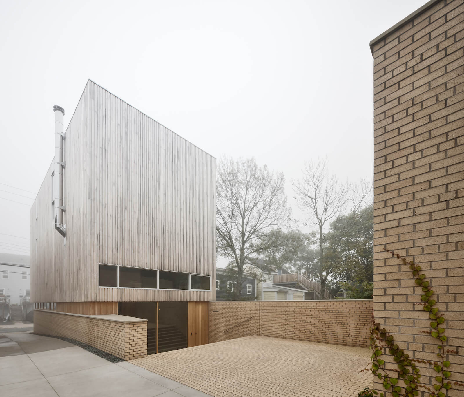 The back of the home, with its verticality emphasized by slender cedar slats.
