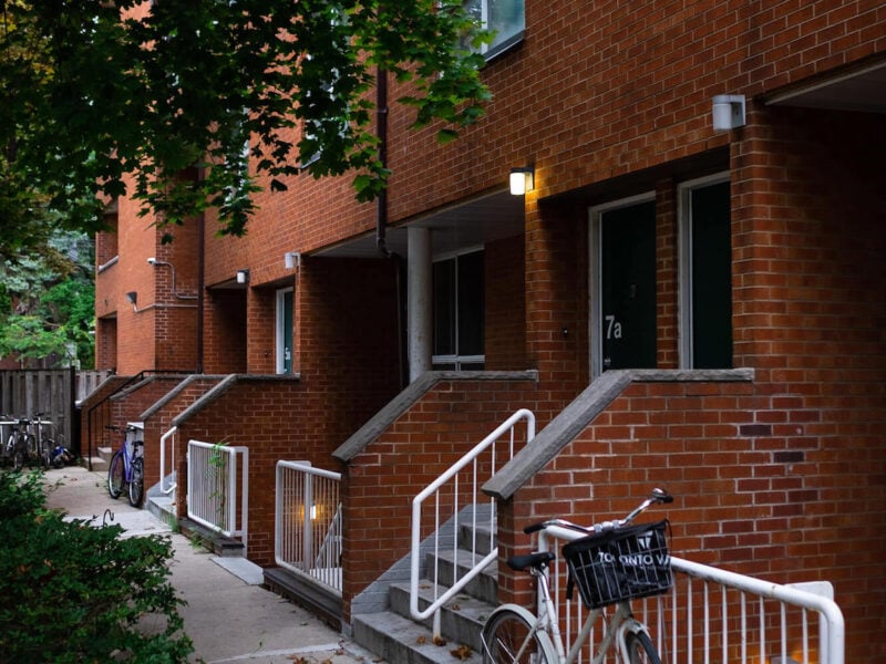 At Toronto's Beverly Place (1978), Rows of townhome entrances replicate the urban rhythm of the area’s older homes.