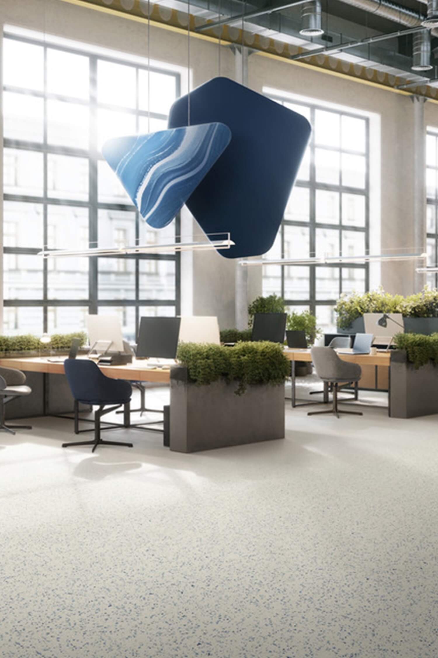 rubber terrazzo flooring in white with dark specks in office space with hanging blue decor