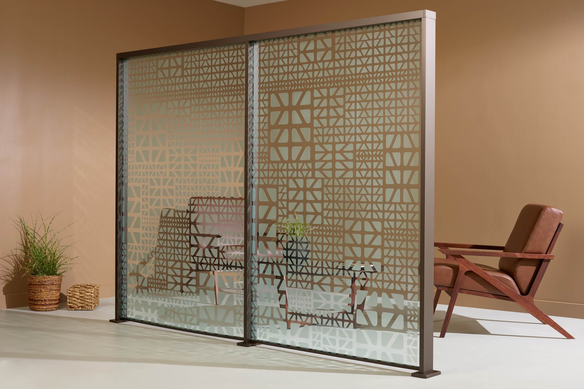 Office furniture glass partition in tan room with sofa chairs