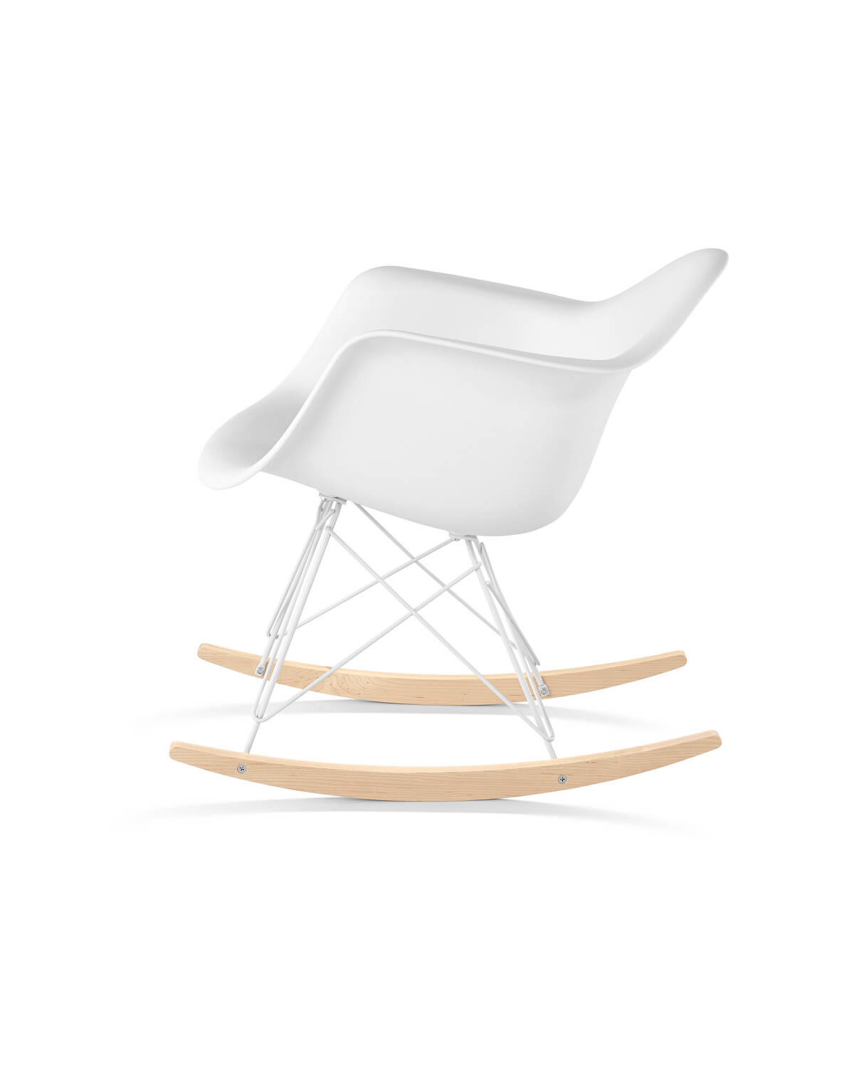A white Eames Molded Plastic chair on a rocking base