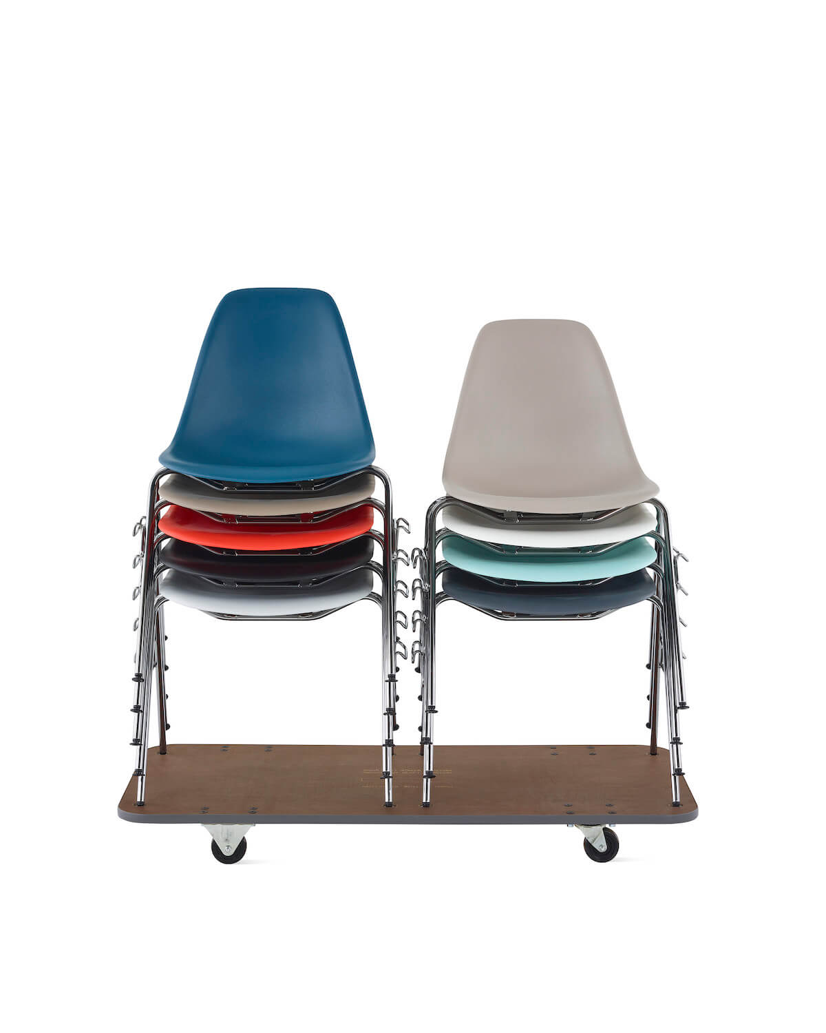 Two stacks of Eames Molded Plastic chairs, made from recycled plastic