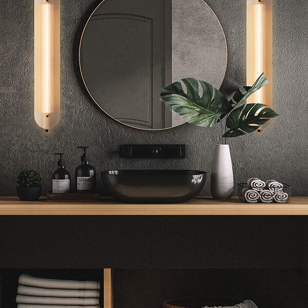 Linea lamps on either side of a round black mirror