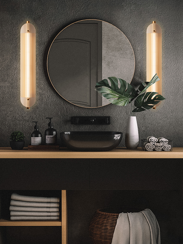 Linea lamps on either side of a round black mirror