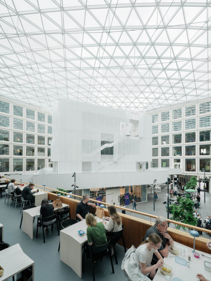 A view of the inner courtyard from the second storey cafe, with the white volume that houses the council chambers seen in the background