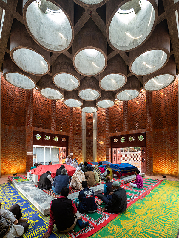 People gathering by the graves at a mausoleum in Bangladesh