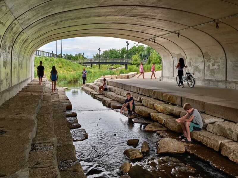 Steps under the bridge facilitate a stronger relationship to Cool Creek, which now flows much more calmly thanks to new stabilization strategies.