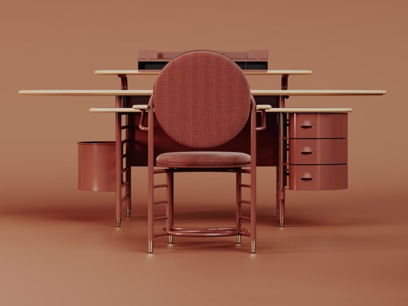 The red Racine desk by Steelcase based on an archival Frank Lloyd Wright design, featuring a side file cabinet and three different work surfaces.