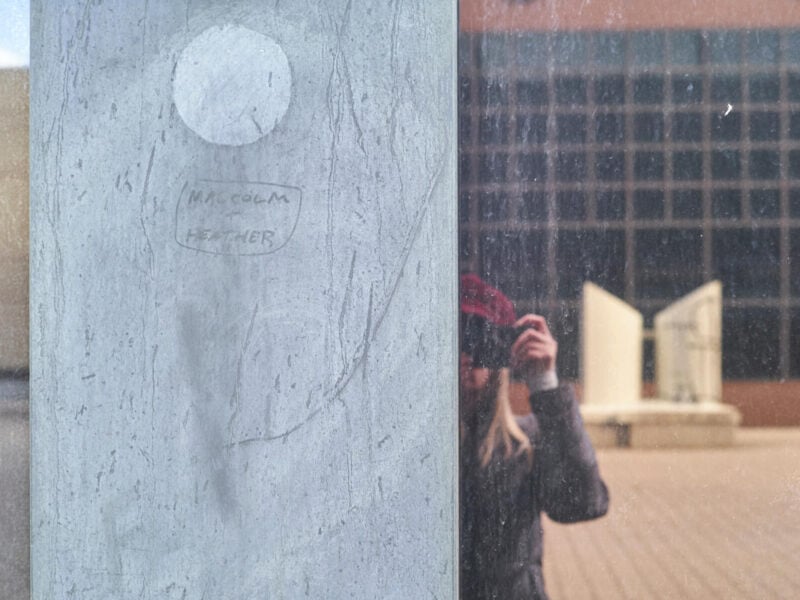 Self-portrait of Sara Heinonen, taken in the reflected glass of Stelco Tower in Hamilton