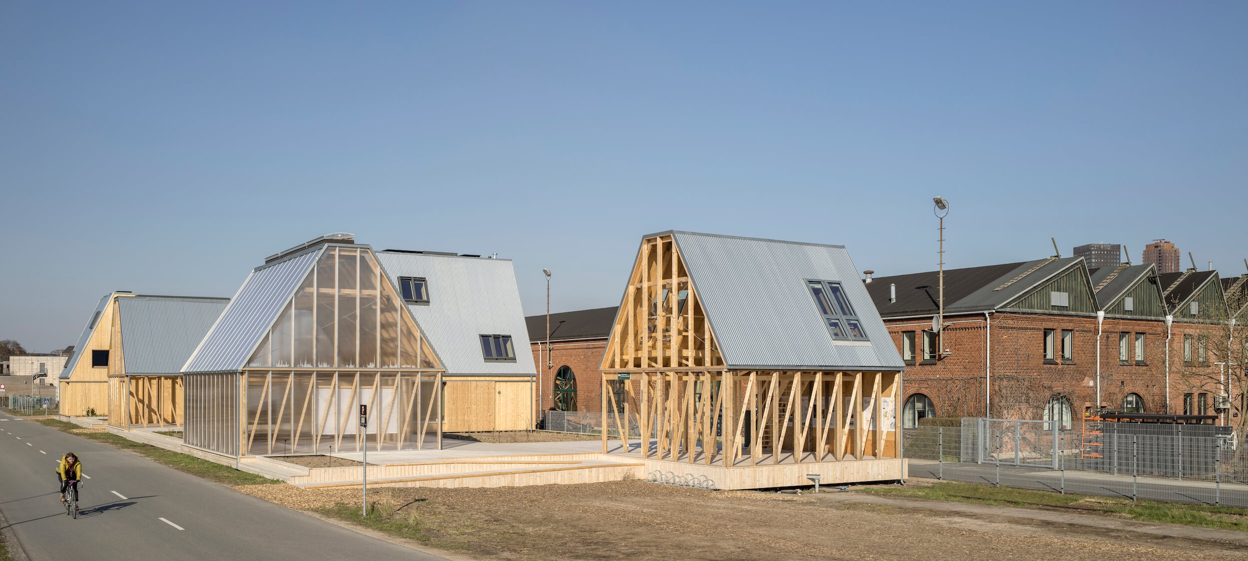 In Copenhagen's old rail district, two houses and five open (and semi-enclosed) pavilions for hosting educational events make up Living Places, designed by Effekt Architects.