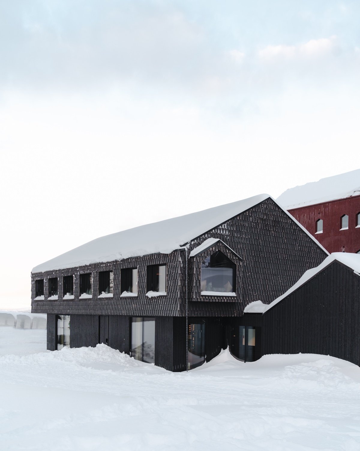 low-rise resort building in black.