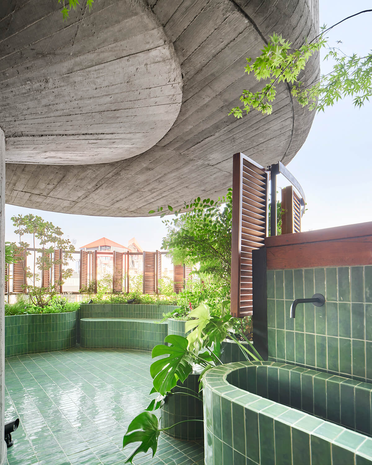 Each of the 5-by-15-centimetre olive green ceramic tiles (part of the Bejmat collection from WOW Design) were hand-laid by an expert installer, a meticulous and laborious endeavour that speaks to Studio.Noju’s attention to detail and appreciation of craftsmanship.