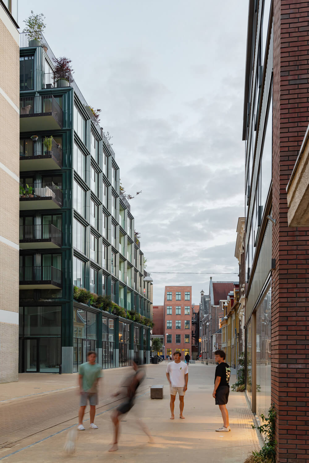 Greenery and Terracotta Frame a Dutch Apartment Complex