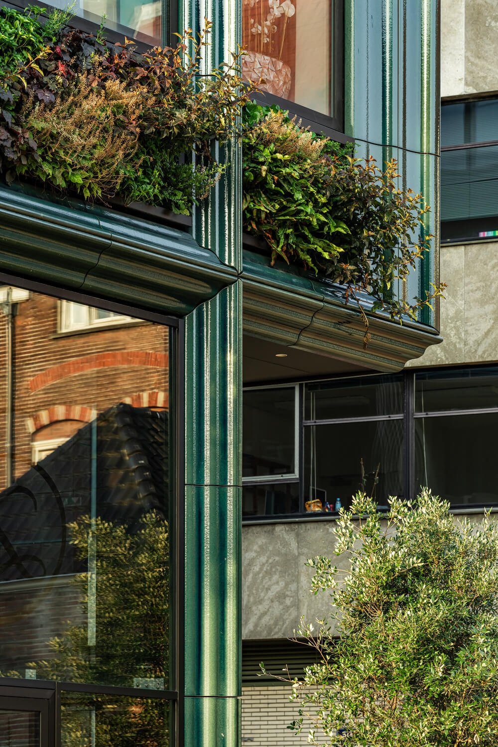 Greenery and Terracotta Frame a Dutch Apartment Complex