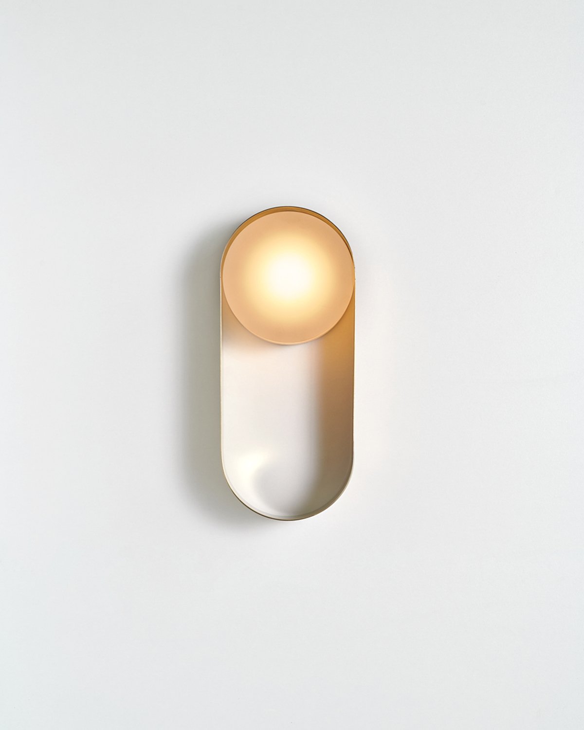 The Oyster sconce by Toronto studio hollis+morris features a moulded steel ribbon.