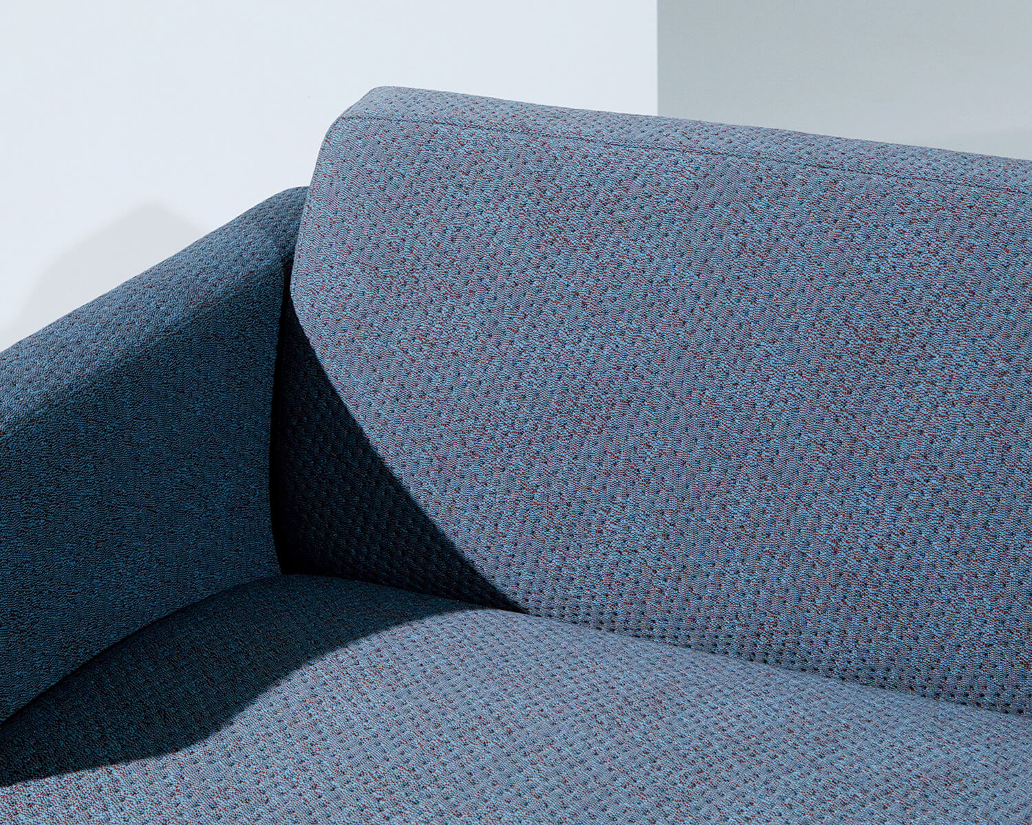 Sofa upholstered in Rumor textile by Kvadrat