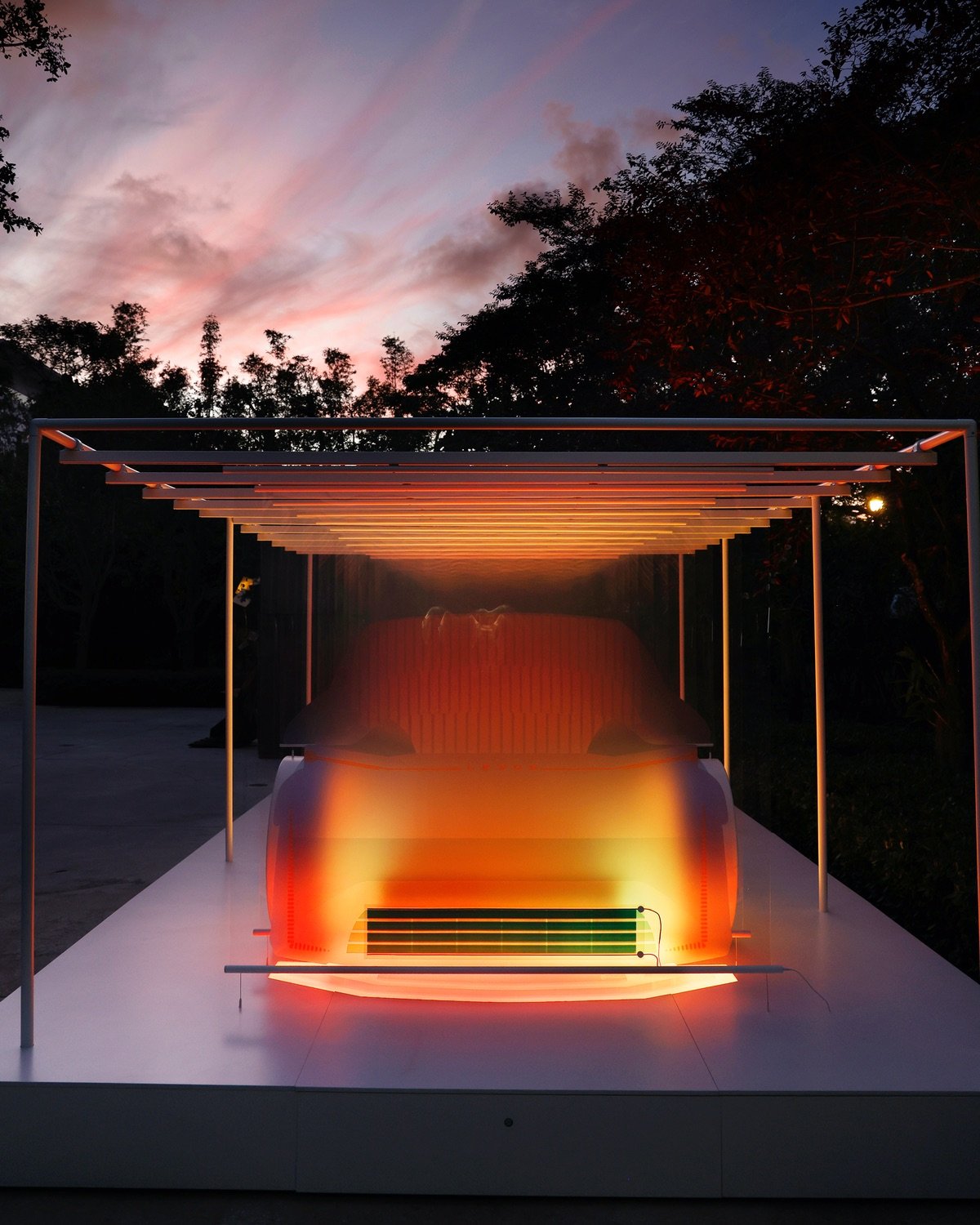A view of the installation at night, with the car silhouette glowing orange. Marjan van Aubel discusses more about the design in an accompanying interview.