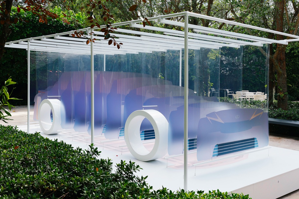 An installation by Marjan van Aubel recreating the silhouette of a Lexus car with transparent sheets featuring printed imagery. Marjan van Aubel discusses more about the design in an accompanying interview.