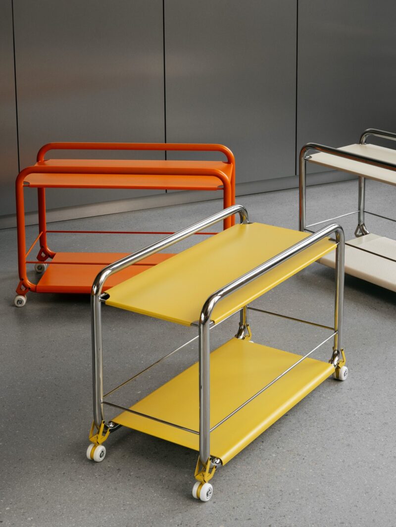 A trio of Tension trolleys in orange, yellow and beige and all featuring rounded steel frames. The design was launched by Lammhults at the Stockholm Furniture Fair at Stockholm Design Week 2024.