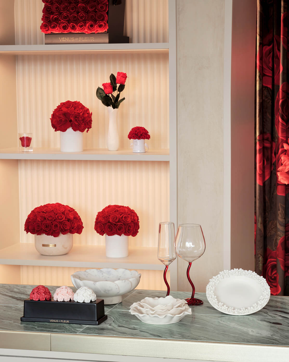 Bouquets of red roses on display in recessed shelving