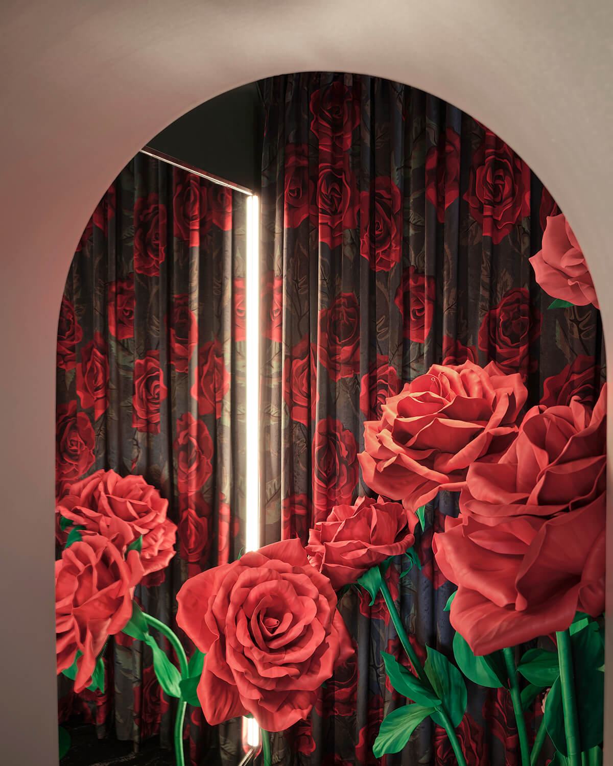 Room with floral curtains and oversized rose sculptures