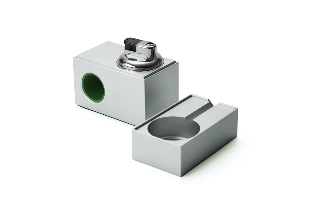 Two aluminum blocks, one with a finger hole cutout and a lighter on top and one with a circular ash tray indent. They are from Houseplant, a celebrity brand led by Seth Rogen. The designer behind the product is Castor.