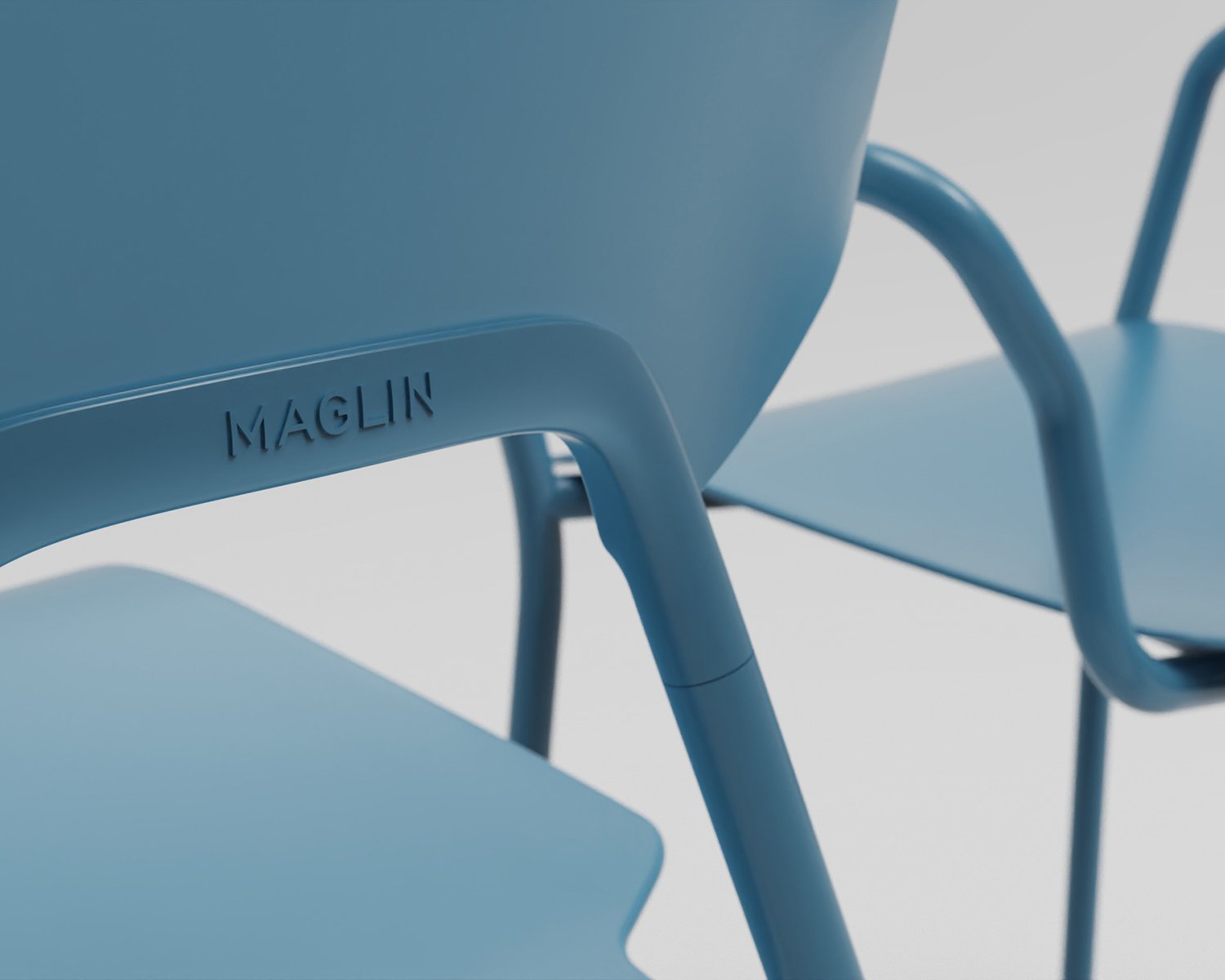 Close up of blue chair with Maglin decal on the back