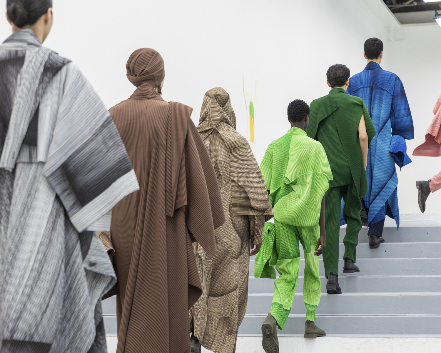Ronan Bouroullec's Homme Plissé Issey Miyake, models walking from the back