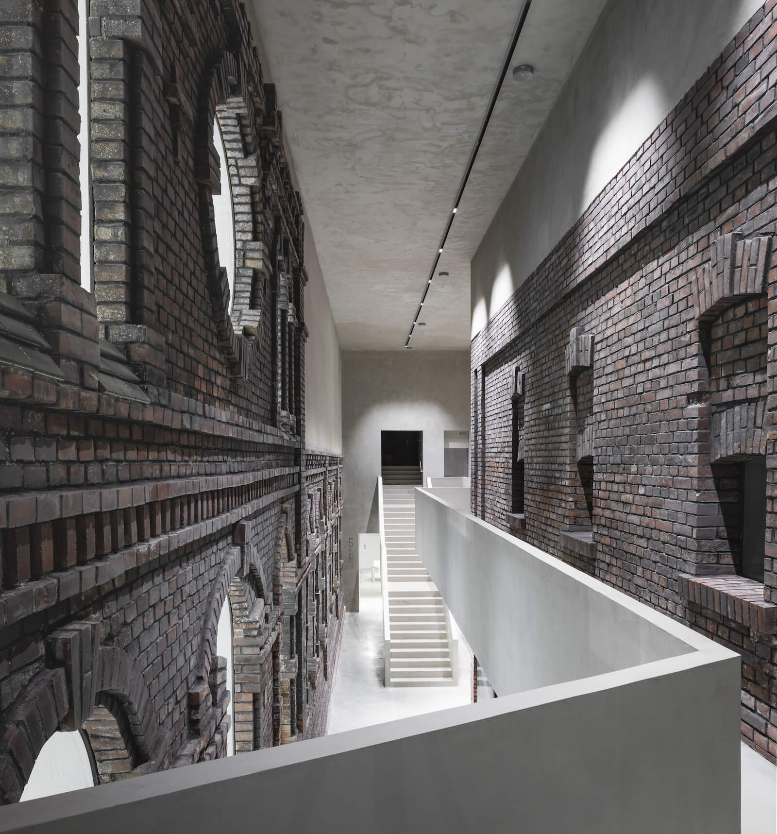 KWK Promes inserted new circulation routes through Plato art gallery in Ostrava, Czechia.