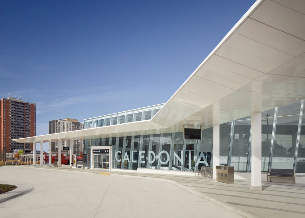 The signature canopy deployed at a large-scale welcomes passengers transferring from the city bus network.