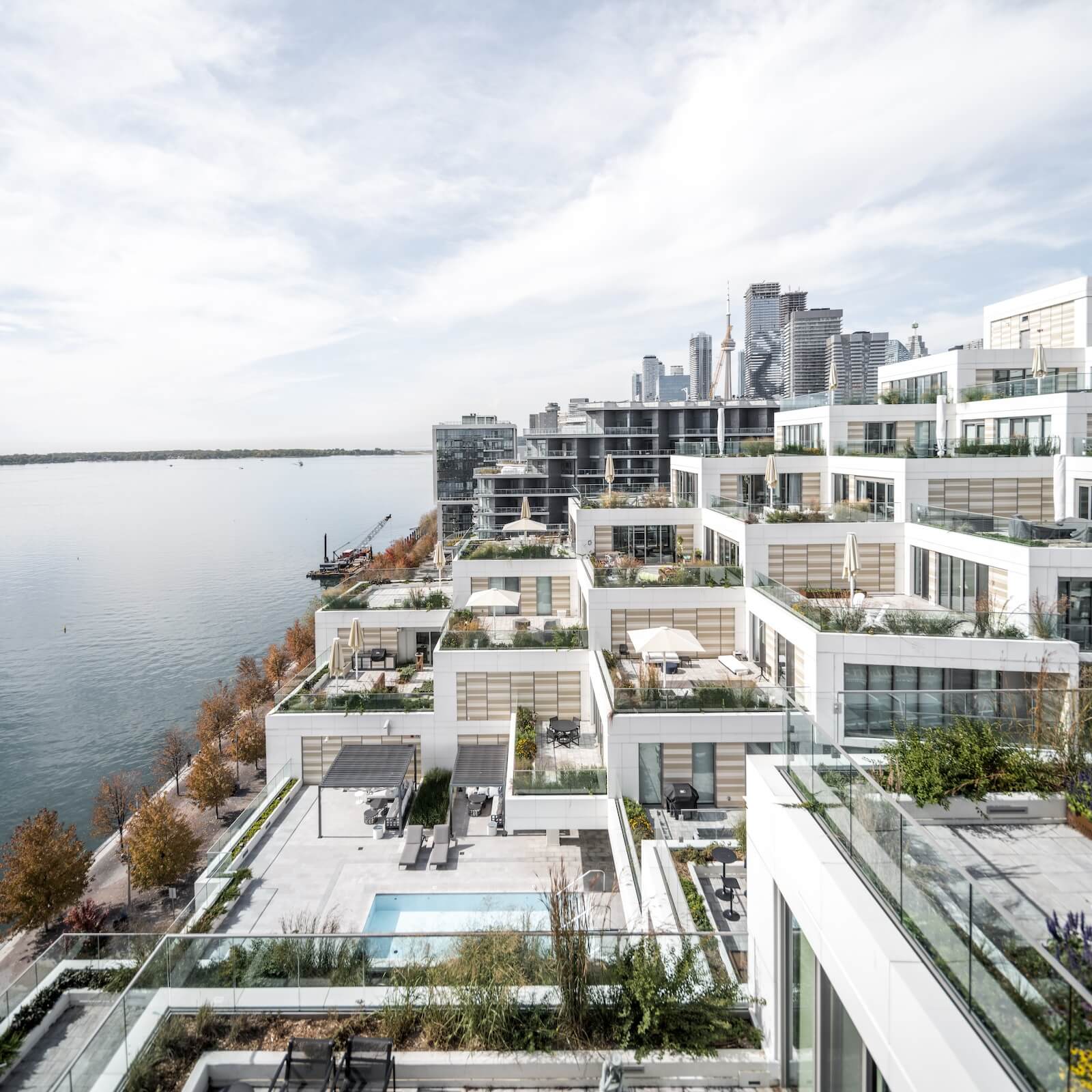 At East Bayfront in Toronto by 3XN, Aquabella’s twin peaks and stacked units allow for terraces that step down toward Lake Ontario.