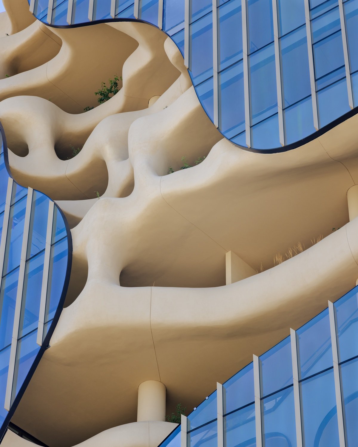 A closeup of the exterior pathways carved into One River North, a canyon-like building in Denver.