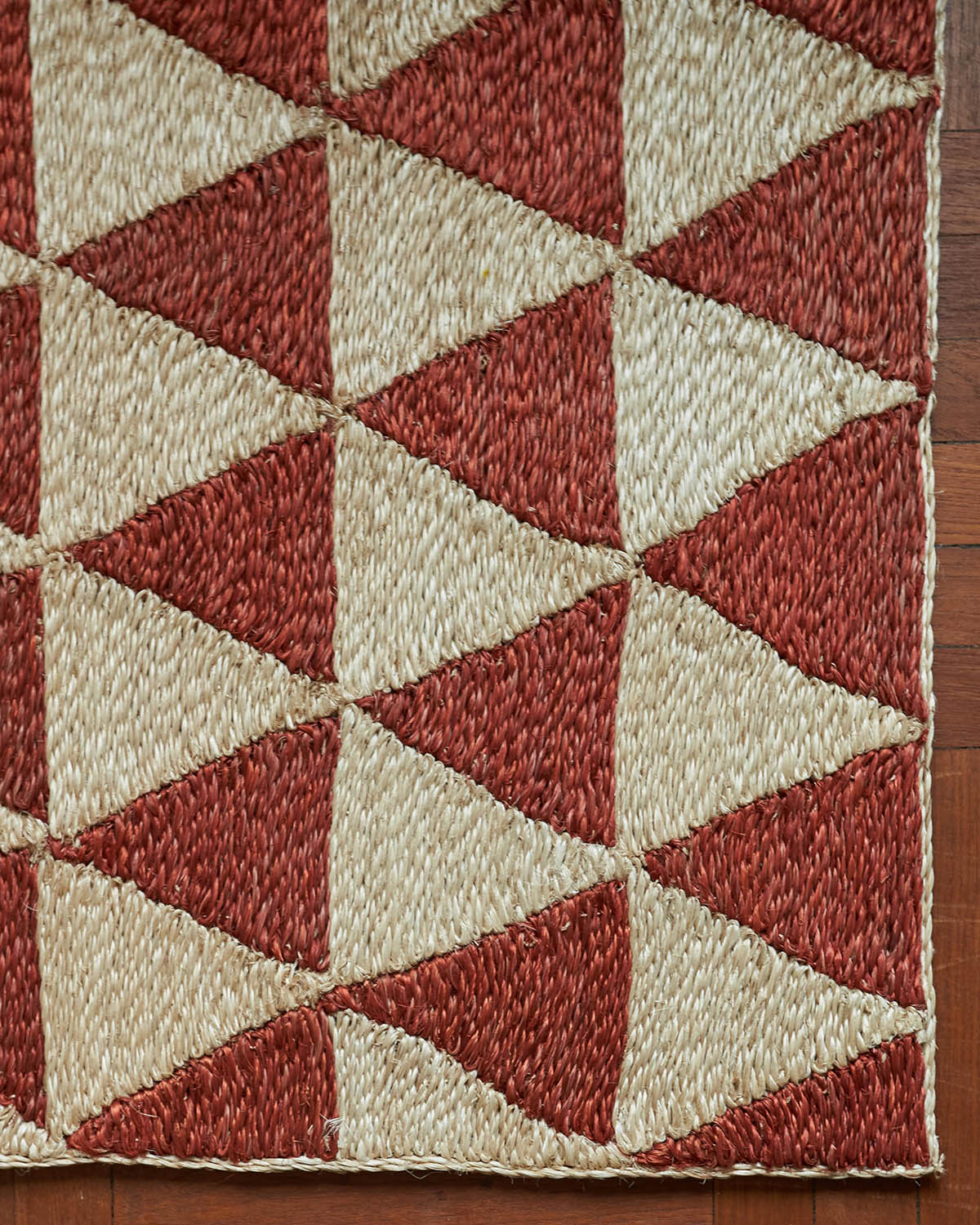 Rug with red and white triangular pattern