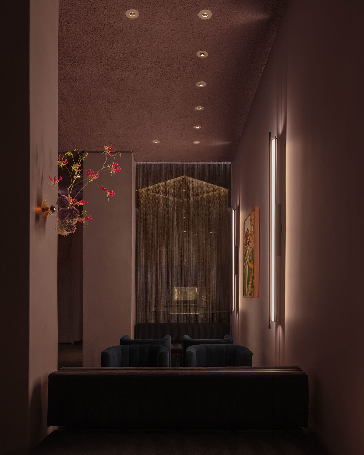 Lights illuminate sheets of Kriskadecor’s aluminum links — used here as a reference to surveyor’s chains