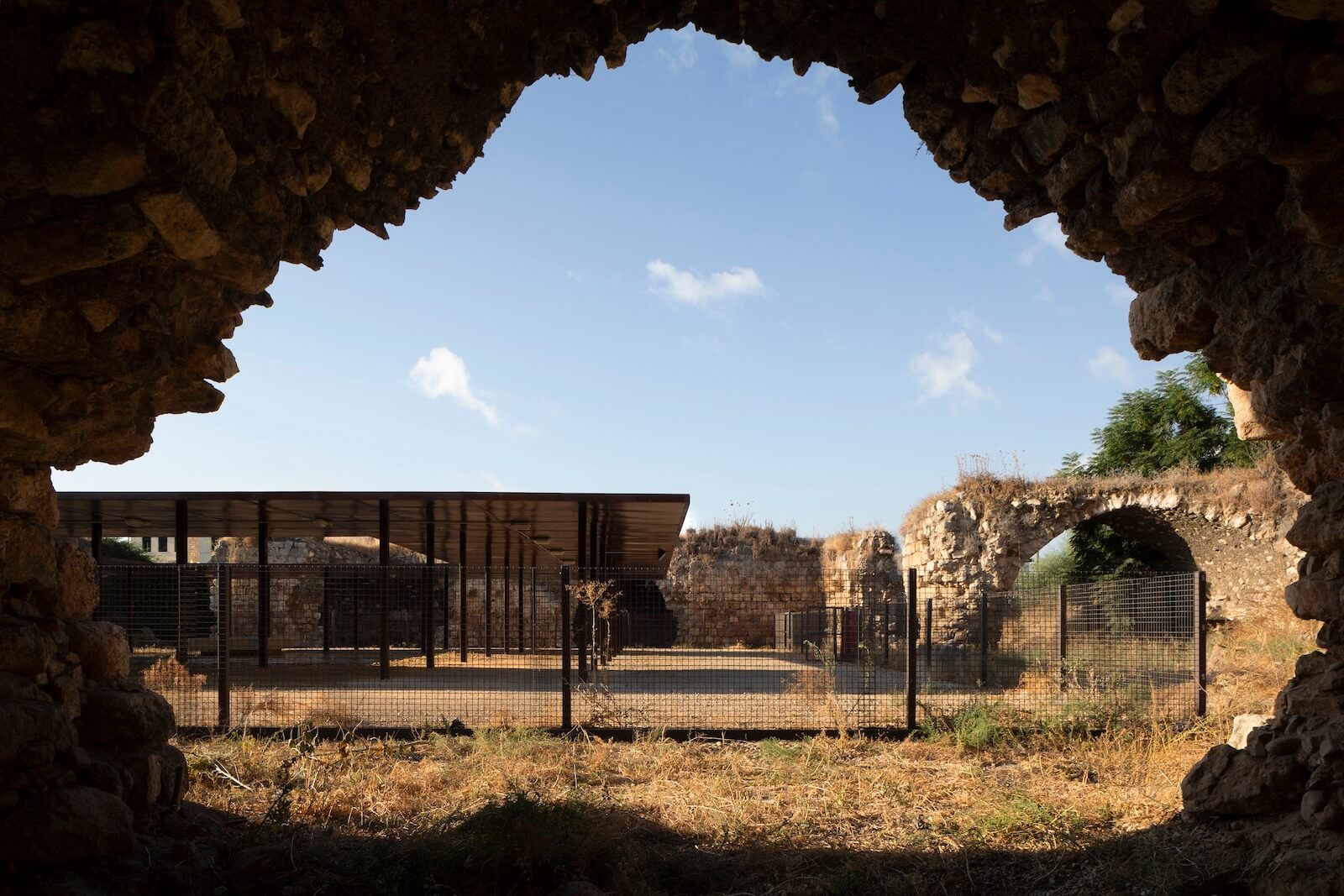 Architect Elias Khuri revived the inner courtyard and semi-ruined eastern section of the Khan of Jaljulia, built between 1312 and 1340. The new structure employs an abstract grid of columns, recovered from the original volumes, that invokes the colonnaded courtyards of Arab mosques.