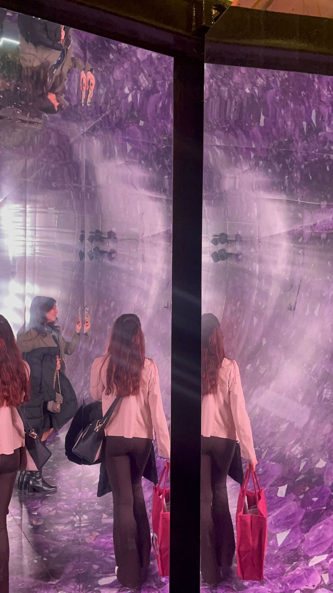 A reimagining of the hotel spa by Rollout and Coolab at IDS 2025, using mirrors and wallpapered surfaces with amethyst colouring.