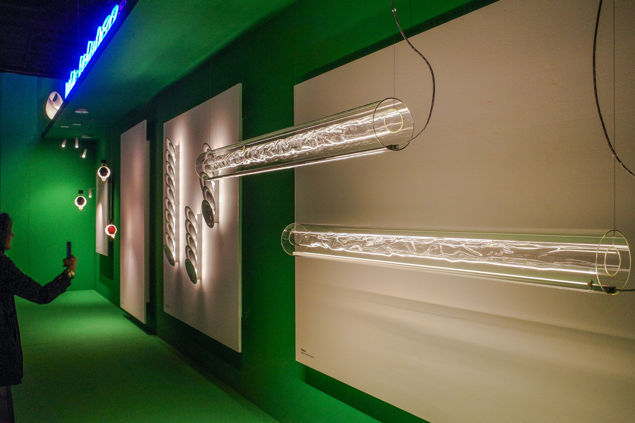 A tubular glass pendant at Euroluce during Salone del Mobile 2025.