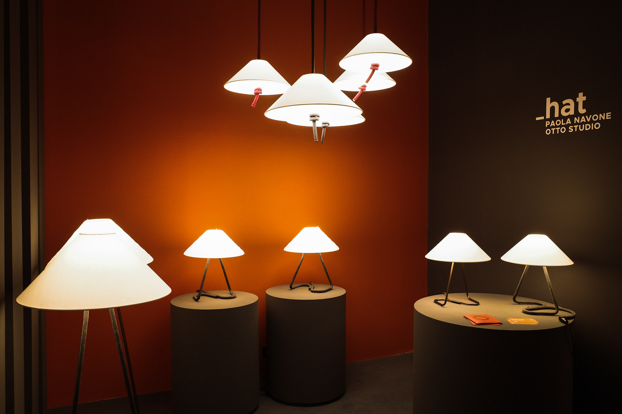A row of new table lamps and pendant lighting launches with conical paper shades in Contardi's Euroluce booth at Salone del Mobile 2025.