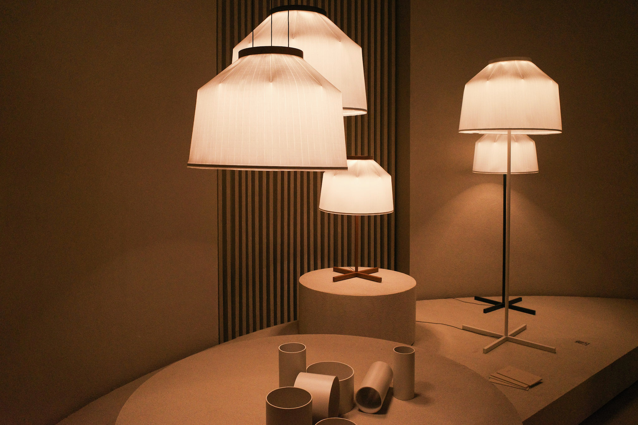A series of new lighting launches with thin fabric shades at Vibia's booth, part of the best of Salone del Mobile 2025.