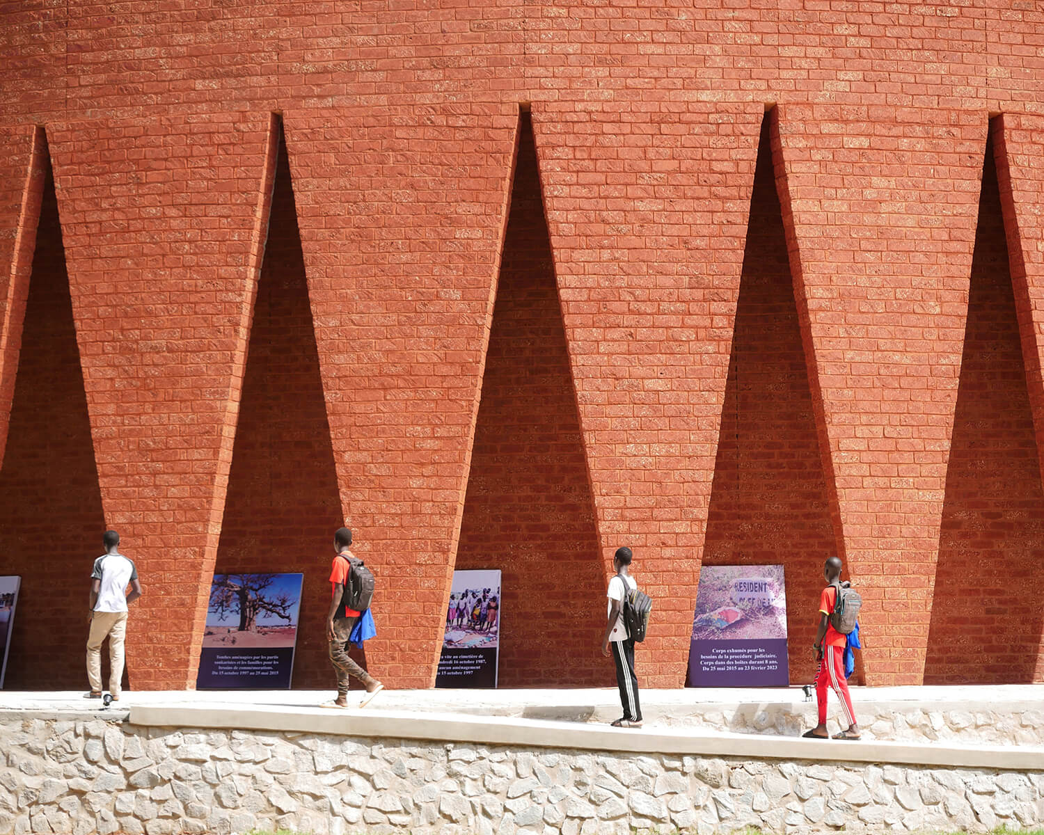 Exterior view of the Thomas Sankara Mausoleum, showing the triangular cutouts in the brick facade