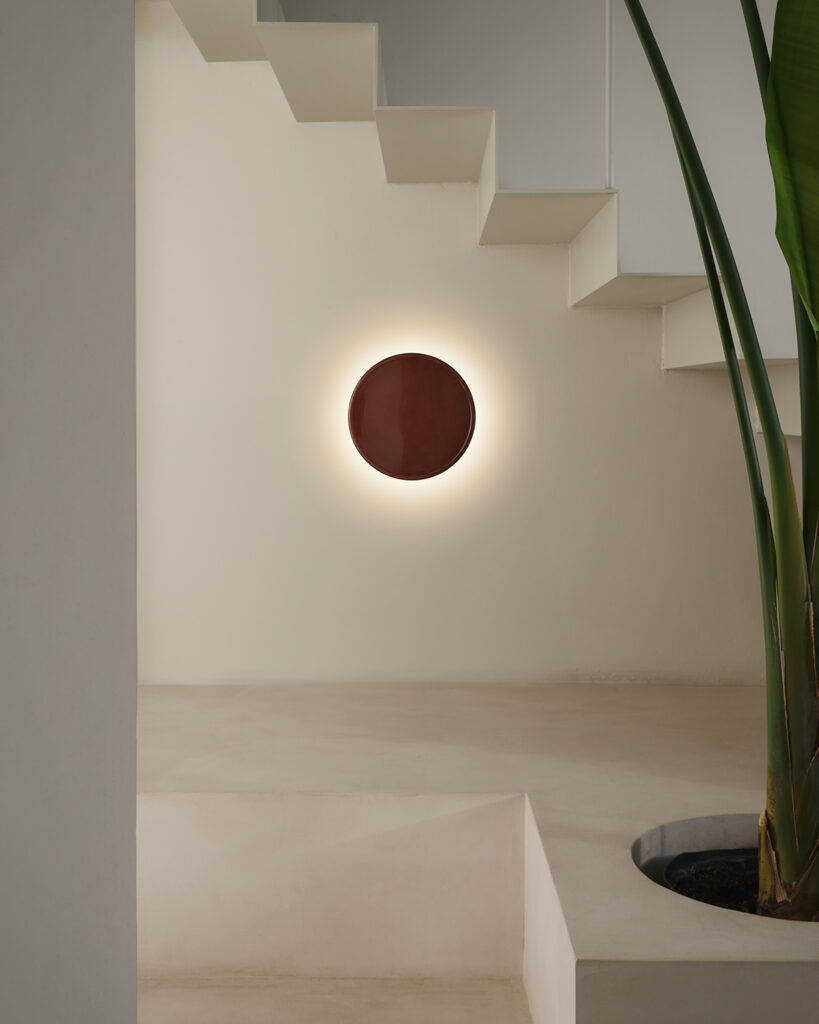 Red circular wall sconce