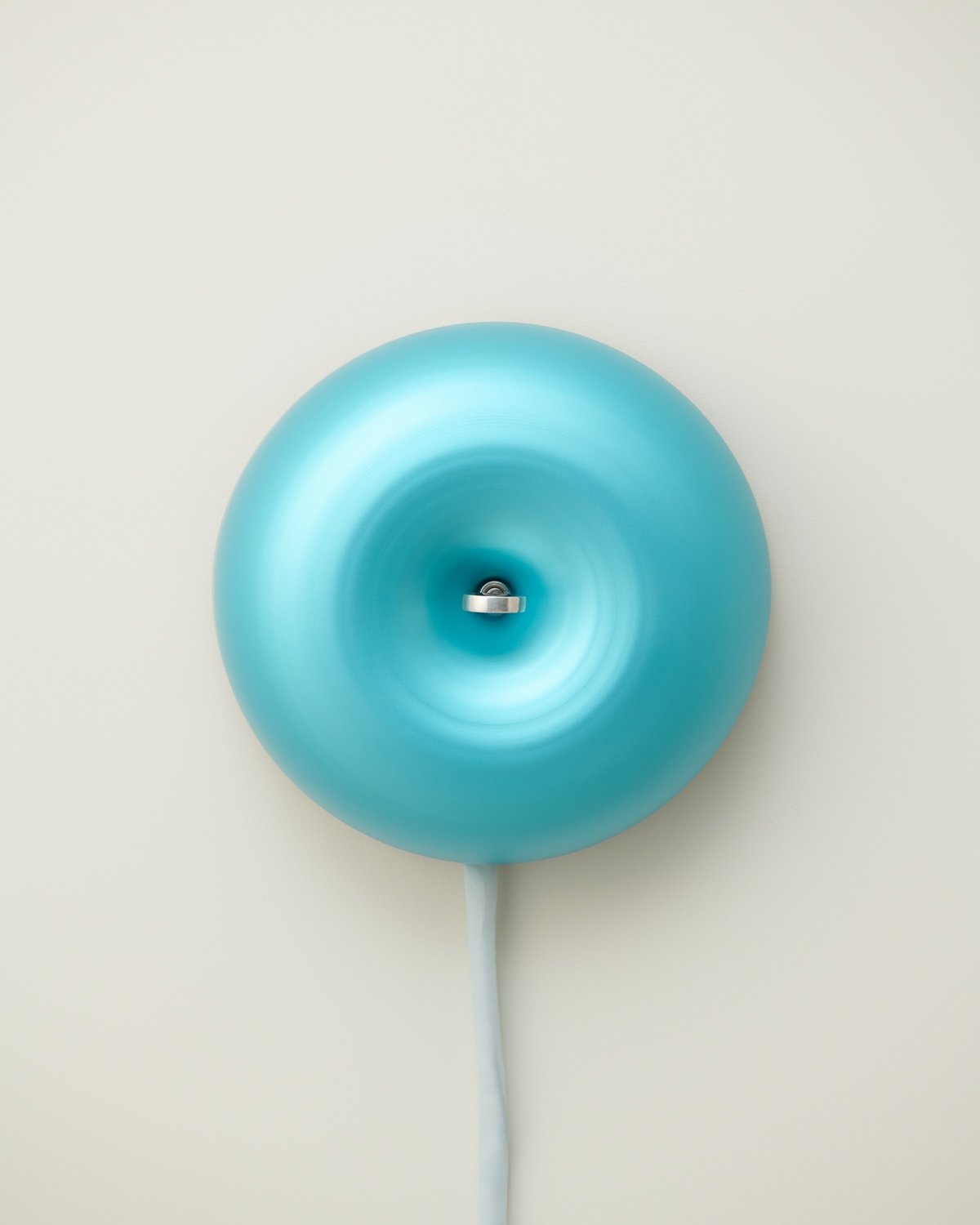 A cerulean metal school bell.