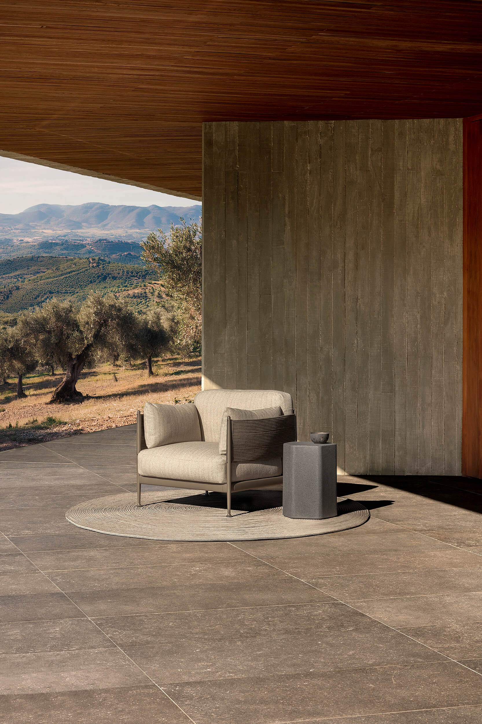 The updated Obi armchair showcases the expanded, hand-sewn belt.