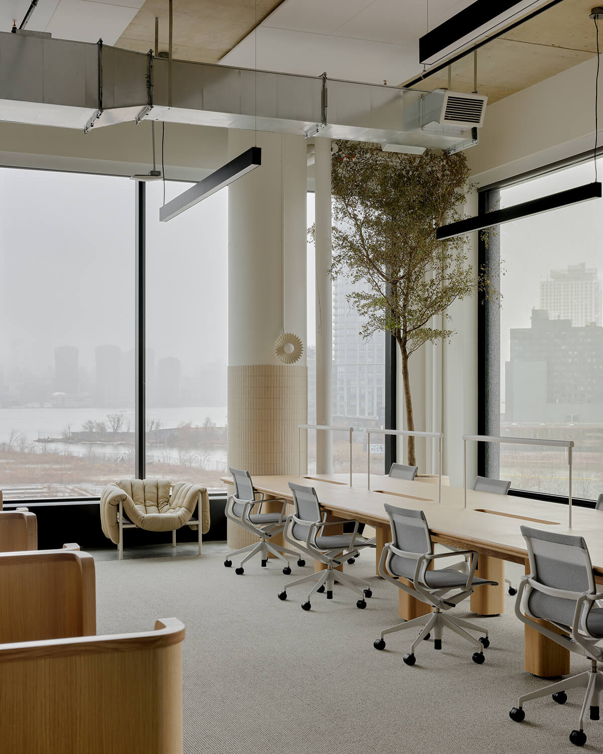 Communal work table at amika HQ in Brooklyn, designed by CIVILIAN