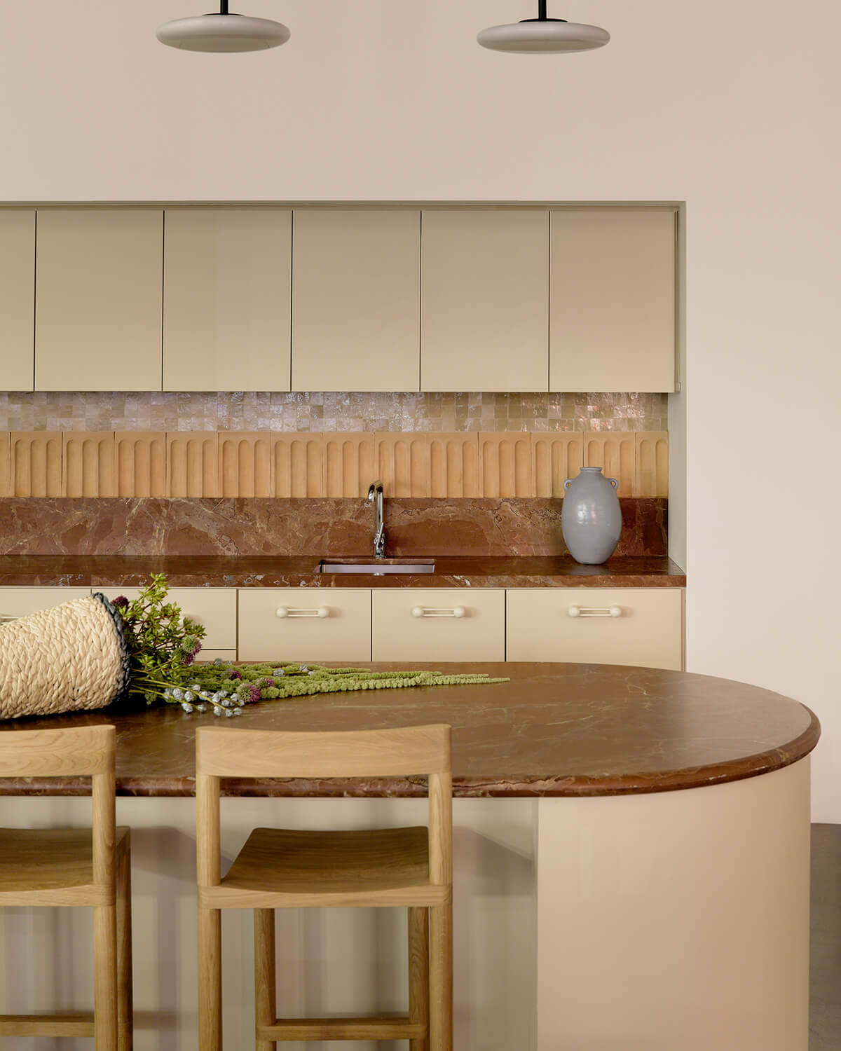 Kitchen with red marble countertops