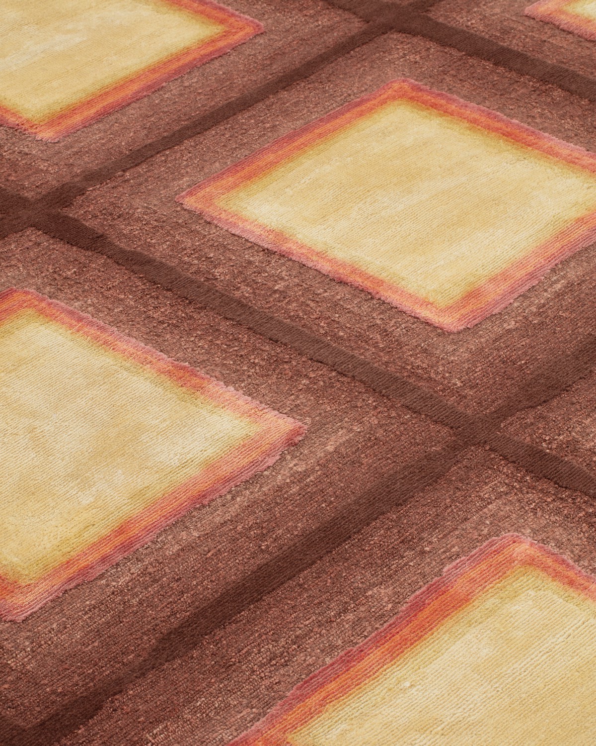 A closeup of the rug showing the various colourful borders around each square.